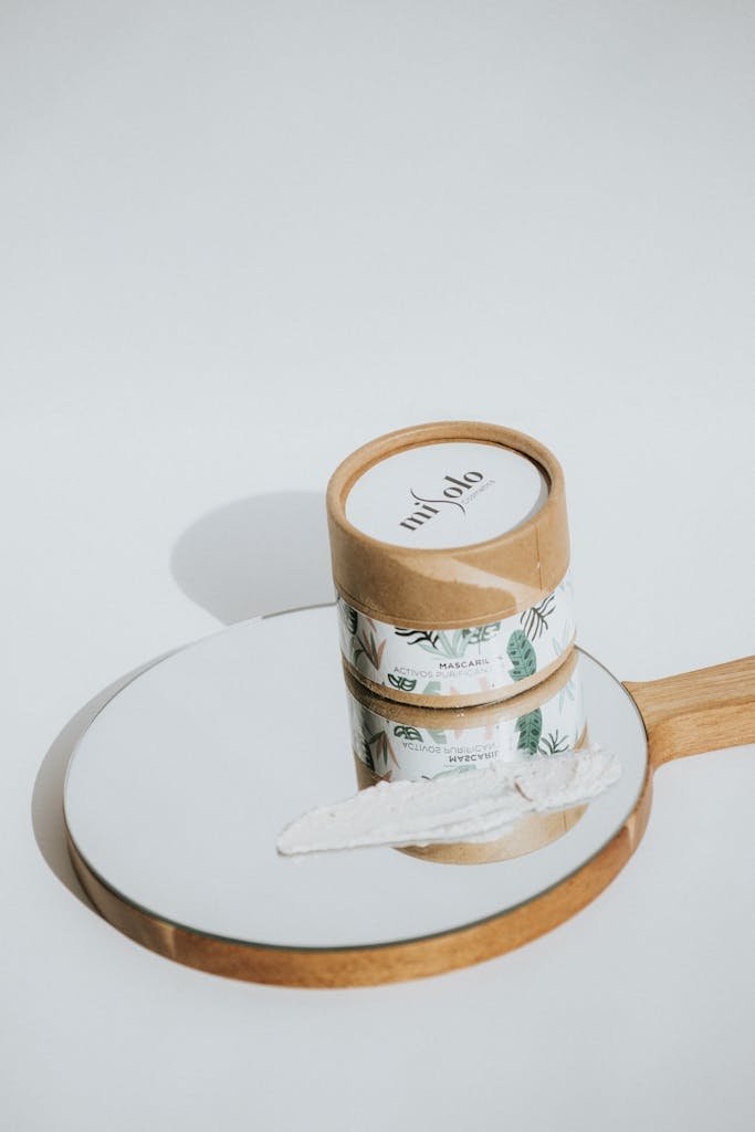 Minimalist beauty product on mirror with natural theme packaging.